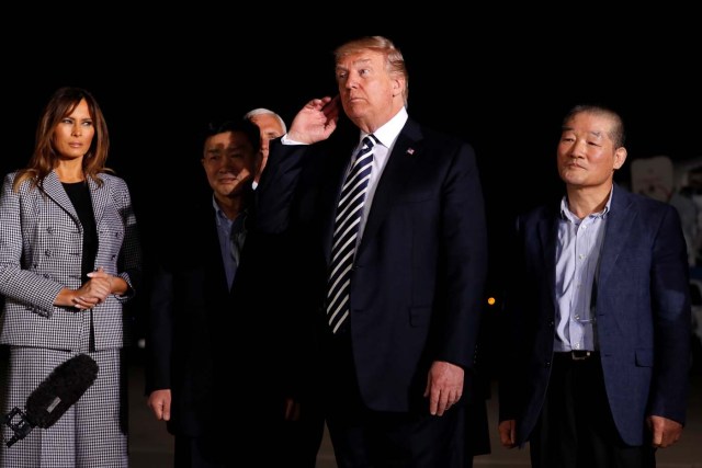 U.S.President Donald Trump listens to a question from reporters as he meets the three Americans released from detention in North Korea upon their arrival at Joint Base Andrews, Maryland, U.S. May 10, 2018. REUTERS/Jonathan Ernst