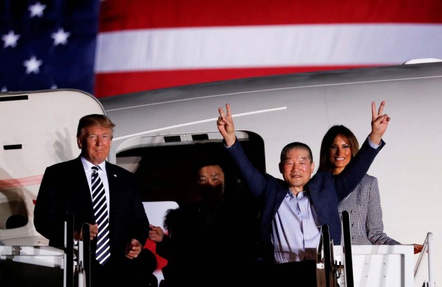 One of the Americans formerly held hostage in North Korea gestures next to U.S.President Donald Trump and first lady Melania Trump, upon their arrival at Joint Base Andrews, Maryland, U.S., May 10, 2018. REUTERS/Jonathan Ernst TPX IMAGES OF THE DAY
